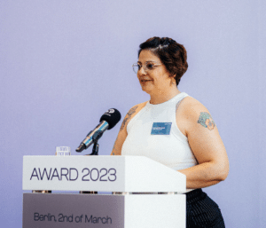 Melissa Bruntlett speaking at the Remarkable Feminist Voices Award Ceremony by Women Mobilize Women 2023